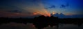 Panorama sunset in sky beautiful colorful landscape silhouette tree woodland and river reflect the twilight time Royalty Free Stock Photo