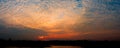 Panorama sunset in sky beautiful colorful landscape silhouette tree woodland and river reflect the twilight time Royalty Free Stock Photo