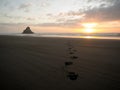 Panorama sunset view of Paratahi Island rock on black sand Karekare Beach West Auckland North Island New Zealand Royalty Free Stock Photo