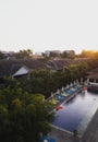 Panorama sunset view of swimming pool in hotel resort tropical island Seminyak Bali Indonesia Asia Royalty Free Stock Photo