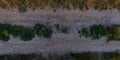 Panorama of surface from above of gravel road with car tire tracks Royalty Free Stock Photo