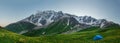 Panorama Svaneti mountains in Georgia. Landscape of Caucasus mountain range. Scenic mountains with tent in tourist camp Royalty Free Stock Photo