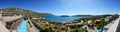 Panorama of swimming pools at luxury hotel with a view on Spinalonga Island Royalty Free Stock Photo