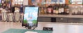 Panorama tablet with swipe magnetic credit card reader to order food and drink at airport bar restaurant in Texas, USA Royalty Free Stock Photo