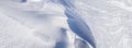 Panorama of Texture of snow waves in bright sunlight Royalty Free Stock Photo