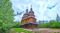 Panorama with wooden church and its blooming garden, Mamajeva Sloboda Cossack Village, Kyiv, Ukraine