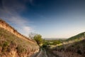 Panorama of Titelski breg, or titel hill, in Vojvodina, Serbia, with a dirtpath countryside road, in an agricultural landscape ay Royalty Free Stock Photo