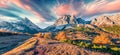 Panorama from top of Falzarego pass with Lagazuoi mountain range. Colorful autumn morning in Dolomite Alps, Cortina d`Ampezzo Royalty Free Stock Photo