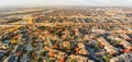 Panoramic aerial view apartment complex and sprawl subdivision with fall foliage near Dallas