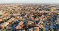 Panoramic aerial view apartment complex and sprawl subdivision with fall foliage near Dallas