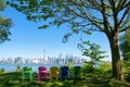 Panorama of Toronto, Canada over chairs different colours and tree from Isand on sunny day Royalty Free Stock Photo