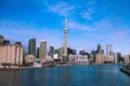 Panorama of Toronto skyline with the famous CN Tower under blue skies