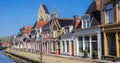 Panorama of the tower of the Martini church along a canal in Bolsward