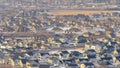 Panorama Tranquil neighborhood nestled amid hilly terrain covered with snow in winter