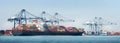 Panorama of Transport Container Cargo Freight Ship loading and unloading goods containers by harbor crane in shipping port Royalty Free Stock Photo