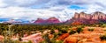 Panorama of Twin Buttes and the Munds Mountain Range, and Thunder Mountain in the distant, near the town of Sedona Royalty Free Stock Photo