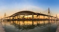 Panorama twin suspension bridge river front with reflection during sunset