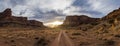 Panorama of a two track dirt road heading into the sunset of Canyonlands National Park Royalty Free Stock Photo