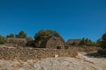 Panorama of typical hut made of stone with walled fence and sunny blue sky, in the Village of Bories, near Gordes. Royalty Free Stock Photo