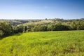 Panorama of a typical serbian rural landscape with farm estates, grass fields, buildings and barns surrounded by fiels in the