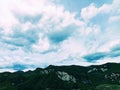 Panorama in Vado with green high mountains white clouds and beautiful sky