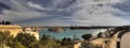 Panorama of the Valletta city harbor area at Malta, with many historic buildings along the coastline and a large park Royalty Free Stock Photo