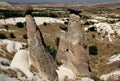 Three mountains (also called Fairy Chimneys or Three Beauties) near the town of Urgup in Cappadocia, Turkey Royalty Free Stock Photo