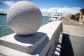 Enetian architecture details. White stone Balls on old authentic bridge parapet with a blue Lagoon in a background in Venice Royalty Free Stock Photo