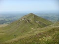 Panorama of the verdant mountains of the Auvergne Vulcanos in France. Royalty Free Stock Photo
