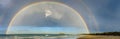 Panorama view across Mystics Beach, Killalea, NSW of double rainbow Royalty Free Stock Photo