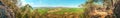 Panorama view of agriculture fields and forest with mountain in the background Royalty Free Stock Photo