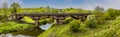 A panorama view of along Chesterfield canal towards the Manton railway viaduct and the town of Worksop in Nottinghamshire, UK Royalty Free Stock Photo