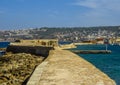 A panorama view along the harbour wall in Chania, Crete on a bright sunny day Royalty Free Stock Photo