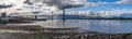 A panorama view along the shore at Queensferry towards the road bridges over the Firth of Forth, Scotland Royalty Free Stock Photo