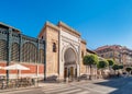 Panorama view of the Arabic marble arch, entrance of the Atarazanas food market in the historic centre of the city of Malaga Royalty Free Stock Photo