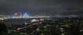 Panorama view of Auckland city at night, with Skytower on the left and Harbour bridge on the right of the image Royalty Free Stock Photo