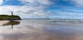 Panorama view of the Ballybunion Castle ruins on the clifftop and Ballybunion Beach in western Ireland