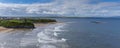 Panorama view of the Ballybunion Castle ruins on the clifftop and Ballybunion Beach in western Ireland