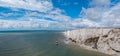 Panorama view of the Beachy Head Lighthouse in the English Channel and the white cliffs of the Jurassic Coast Royalty Free Stock Photo