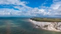 Panorama view of the Beachy Head Lighthouse in the English Channel and the white cliffs of the Jurassic Coast Royalty Free Stock Photo