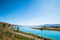 Panorama view of Beautiful scene of Mt Cook and Church of the Good Shepherd beside lake Tekapo with blue sky in summer. New Royalty Free Stock Photo