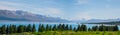 Panorama view of Beautiful scene of Mt Cook in summer beside the lake with green tree and blue sky. New Zealand I Royalty Free Stock Photo