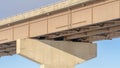 Panorama View beneath a stringer bridge with massive abutment that supports the deck