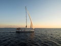 Panorama view of boat sailboat ship sailing into sunset mediterranean sea ocean water Mallorca Balearic Islands Spain Royalty Free Stock Photo