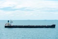 Bulk carrier ship, sailing through calm, blue sea. Royalty Free Stock Photo