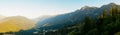 Panorama: View of the Caucasus Mountains at the Rosa Khutor resort at sunset Royalty Free Stock Photo