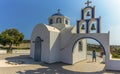 A panorama view of a church and bell tower close to the settlement of Akortiri in Santorini