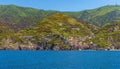 A panorama view of the Cinque Terre village of Riomaggiore, Italy and surrounding cliffs Royalty Free Stock Photo