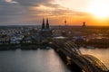 panorama view of Cologne Cathedral and Hohenzollern Bridge at sunset, Germany Royalty Free Stock Photo