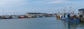 Panorama view of colorful fishing boats in the industrial port and harbor of Hirtshals